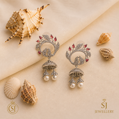 Oxidized silver jhumka earrings with ruby stones and pearl dangles