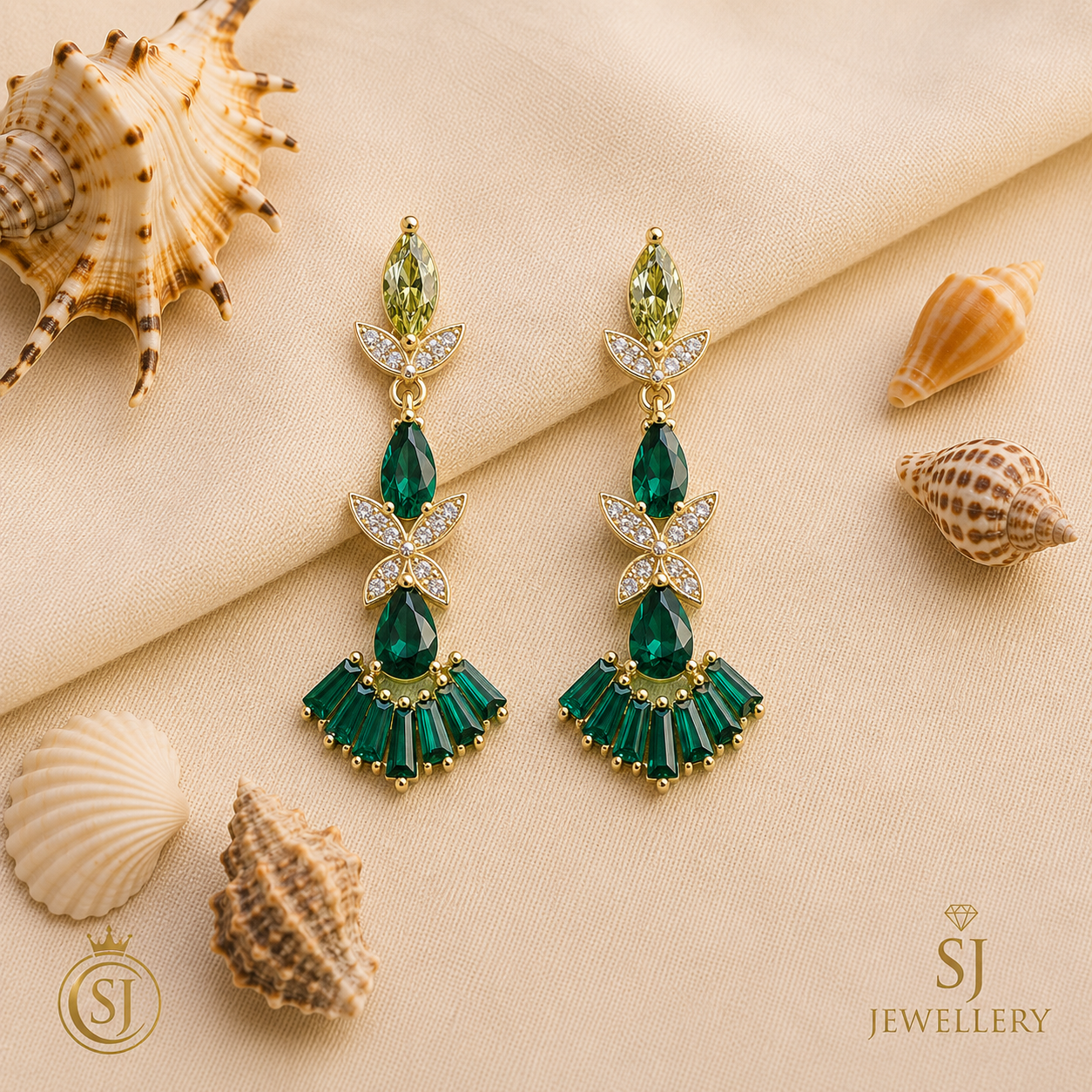 Gold tone emerald green crystal drop earrings with floral fan design, marquise pear baguette stones and clear sparkle details