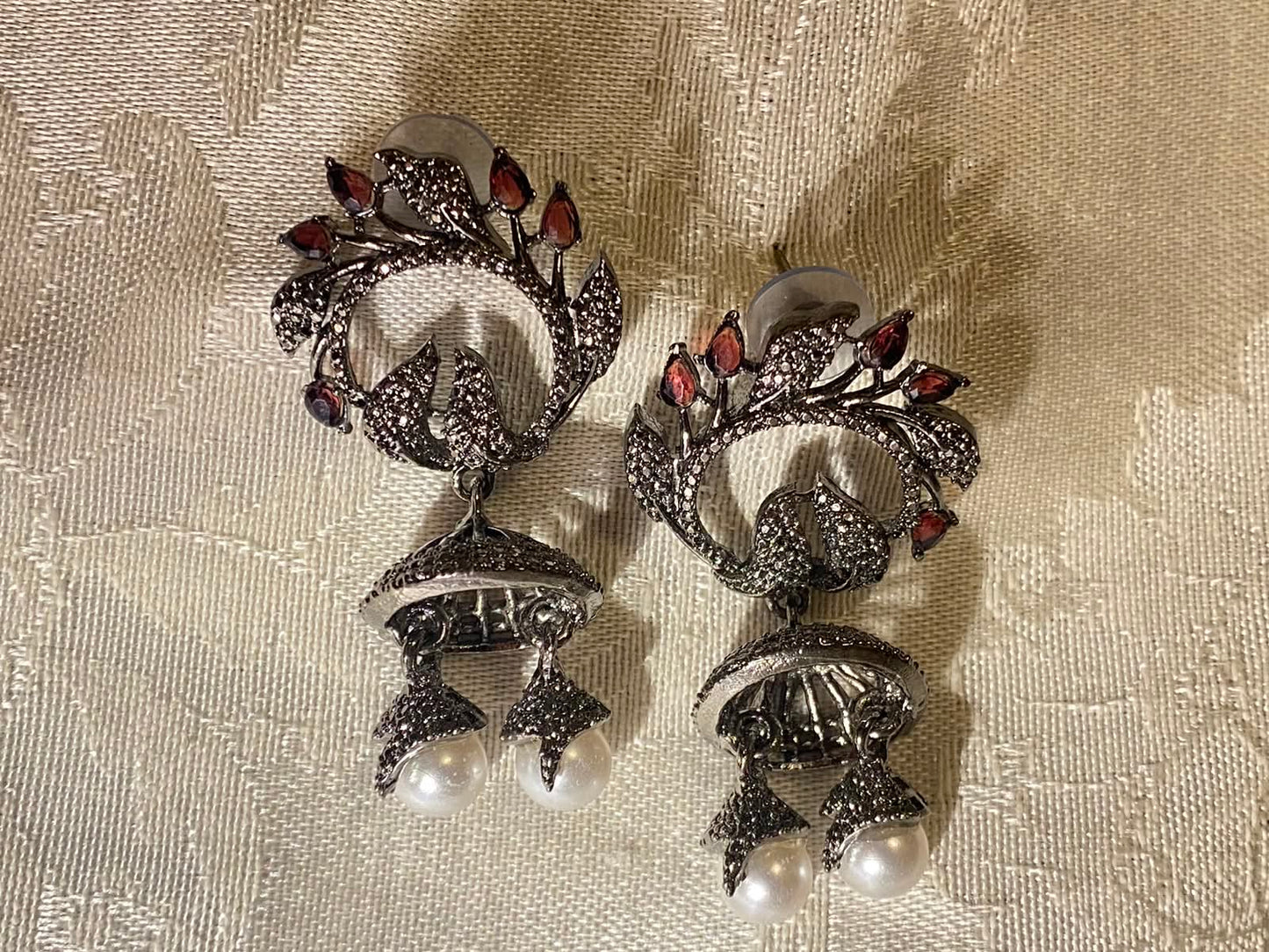 Oxidized silver jhumka earrings with ruby stones and pearl dangles