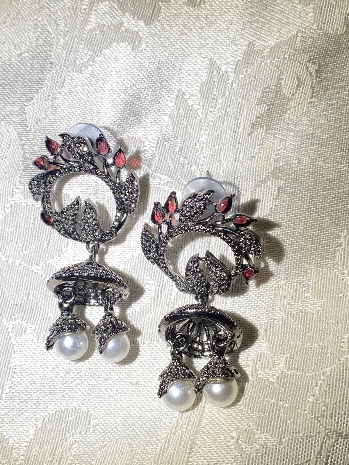 Oxidized silver jhumka earrings with ruby stones and pearl dangles